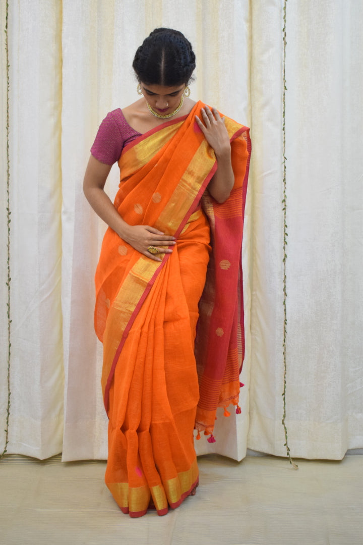 Agneya: Orange Linen Jamdani Saree