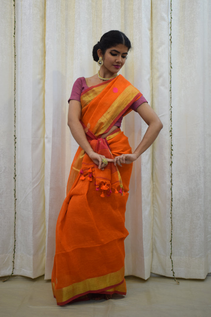 Agneya: Orange Linen Jamdani Saree