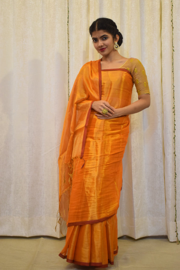 Drishana: Orange zari-Linen Tissue Saree