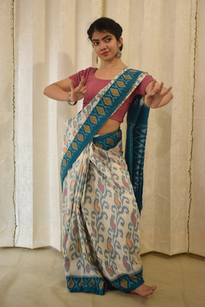 Vasundharā- White & Green Cotton Pochampally Ikat Saree