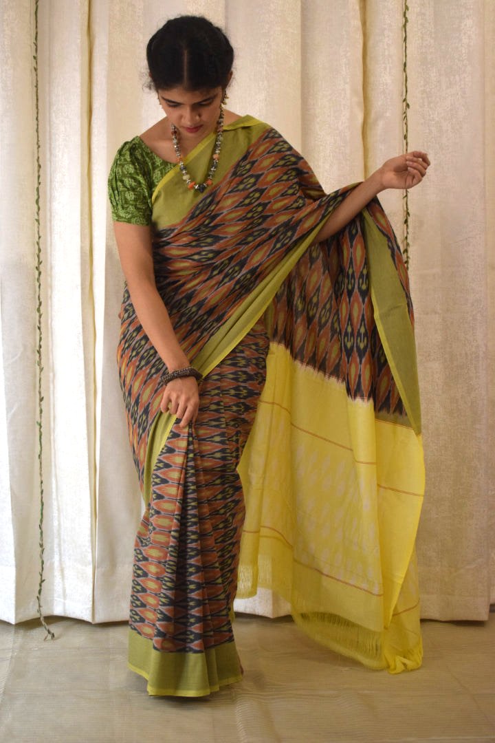 Urvija: Terracota & Yellow Cotton Pochampally Ikat Saree