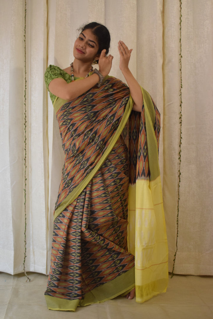 Urvija: Terracota & Yellow Cotton Pochampally Ikat Saree