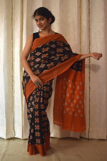 Yamini: Black & Orange Cotton Pochampalli Ikat Saree