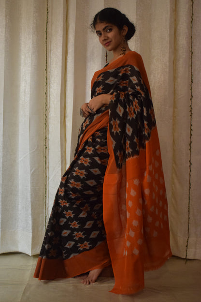 Yamini: Black & Orange Cotton Pochampalli Ikat Saree