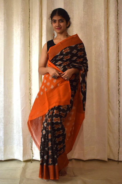 Yamini: Black & Orange Cotton Pochampalli Ikat Saree