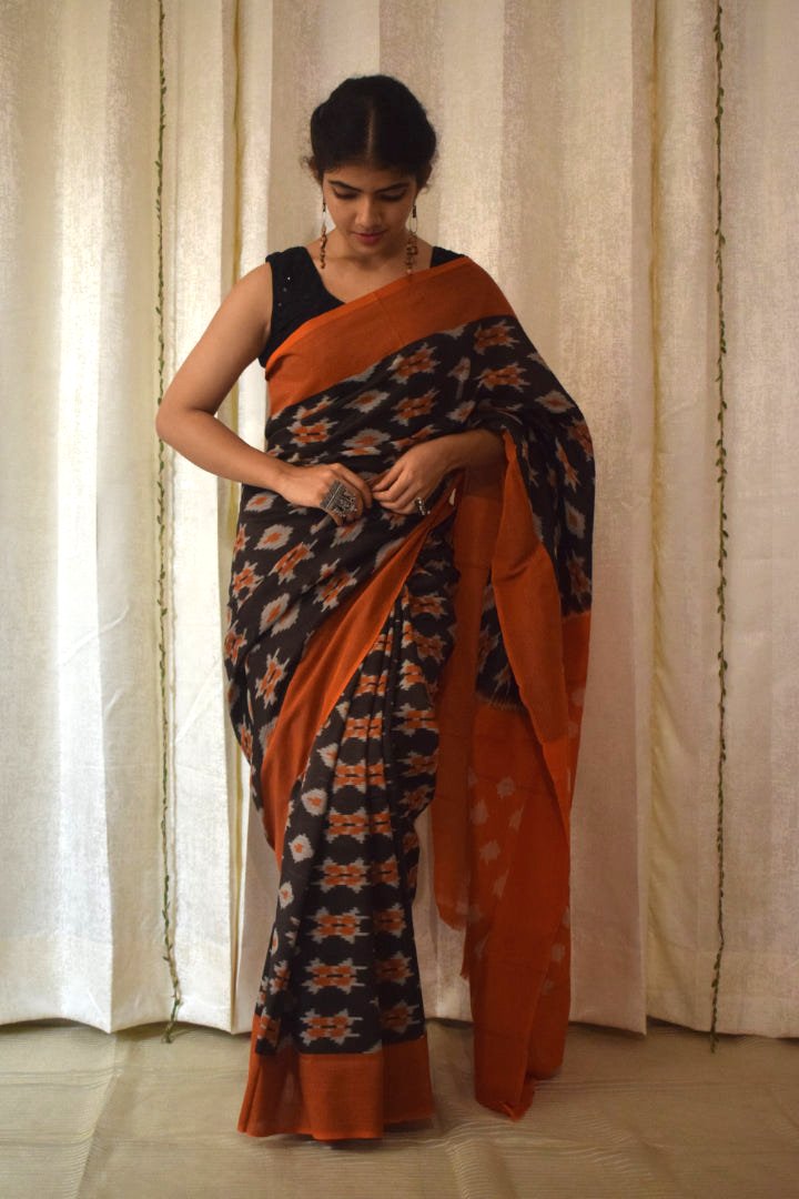 Yamini: Black & Orange Cotton Pochampalli Ikat Saree