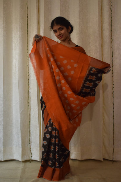 Yamini: Black & Orange Cotton Pochampalli Ikat Saree