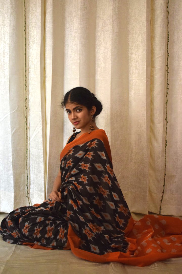 Yamini: Black & Orange Cotton Pochampalli Ikat Saree