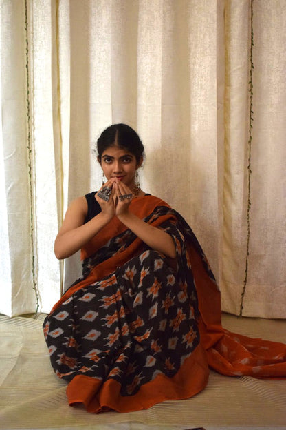 Yamini: Black & Orange Cotton Pochampalli Ikat Saree