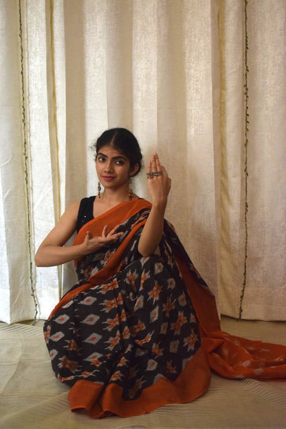 Yamini: Black & Orange Cotton Pochampalli Ikat Saree