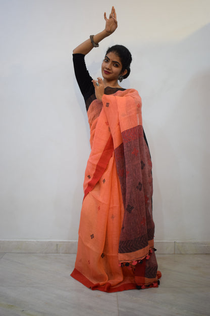 Vasudhākumāri- Peach & Rust Linen Jamdani Saree